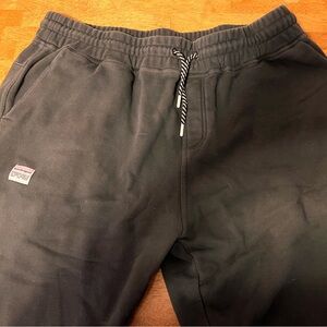 Sweat pants with 2 pockets and a zippered back pocket.